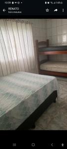 a picture of a bed in a room at Chacara Condomínio Monte Verde Itu in Itu