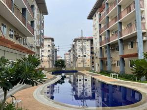a large swimming pool in the middle of a building at Modern Simplicity: Cozy @Nuvali in Pitland