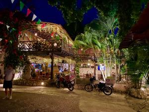 a couple of motorcycles parked outside of a building at Casa San Juan in Valladolid