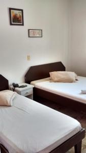 Ліжко або ліжка в номері Hotel Manayara