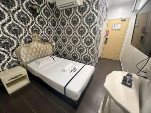 Postel nebo postele na pokoji v ubytování Seeds Hotel Shah Alam Seksyen 7 I-City
