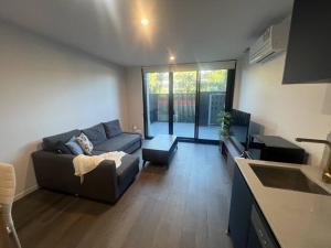 Posezení v ubytování CBD - Pool - Sleeps 4 - Parking