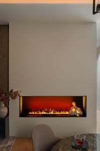 a living room with a fireplace on the wall at An apartment that's located in the center of town. in Antwerp