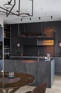 a kitchen with a table in the middle of it at An apartment that's located in the center of town. in Antwerp