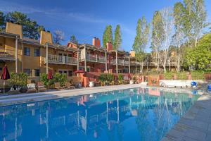 a large swimming pool in front of a resort at Bernardus Lodge & Spa in Carmel Valley