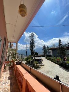 a balcony with a view of a street at NiNi Homestay Sapa in Sa Pa