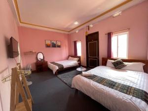 Postel nebo postele na pokoji v ubytování NiNi Homestay Sapa