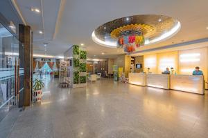 a large lobby with a chandelier in a building at Sunbeam Hotel Pattaya in Pattaya Central +161 photos