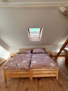 a bedroom with a bed in a room with a window at private house in Ústí nad Labem