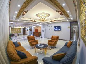 a lobby with couches and chairs and a table at CARAVAN PLAZA BOUTIQUE in Bukhara