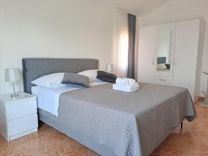 Postel nebo postele na pokoji v ubytování Villa Grace Felice
