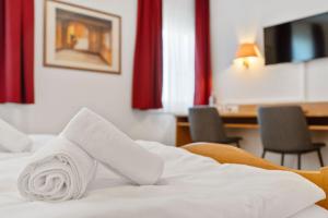Postel nebo postele na pokoji v ubytování Hotel Garni Traube