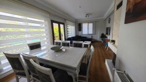 a dining room with a table and chairs at family villas sapanca in Sapanca