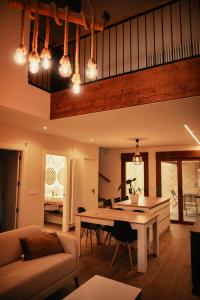 a living room with a table and a couch at La Casina de Palacio in Galisteo