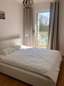 Ένα ή περισσότερα κρεβάτια σε δωμάτιο στο Quiet Ursynow Airport S2