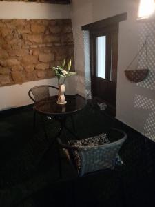 a room with a table and a table and a basket at Claustro Home Casco Histórico Córdoba in Córdoba