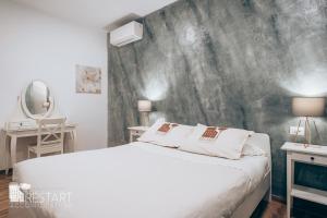 Voodi või voodid majutusasutuse Restart Accommodations Aldobrandini e Sciarra toas