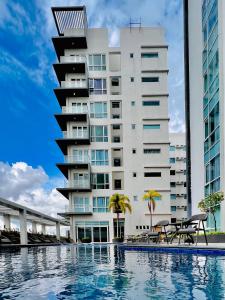 a building with a swimming pool in front of a building at 2* * Contemporary Comfort in Iloilo City