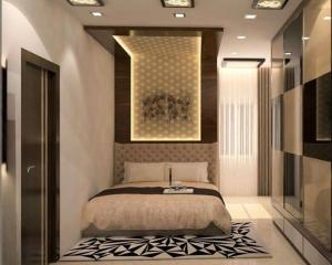 Un pat sau paturi într-o cameră la GuestHouse Gunung Sari