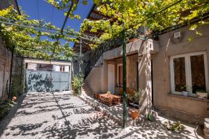 an empty courtyard of a house with trees at Mariana in Gori