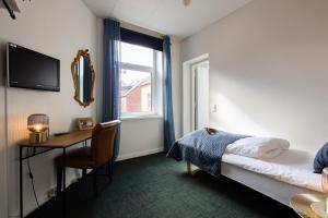 Katil atau katil-katil dalam bilik di Milling Hotel Ansgar