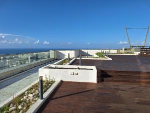 a building with a view of the ocean at BreezHouse P 61 in Ramat Gan