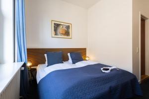 Katil atau katil-katil dalam bilik di Milling Hotel Ansgar