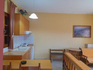 a kitchen and dining room with a table and a dining room at Farma in Taxiarchis