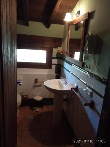 a bathroom with a sink and a toilet at LA CASONA in Jaraiz de la Vera
