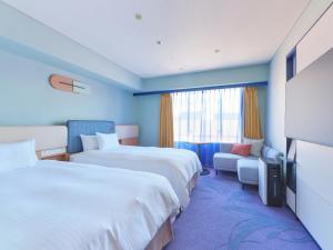 Postel nebo postele na pokoji v ubytování Miyako Hotel Kyoto Hachijo