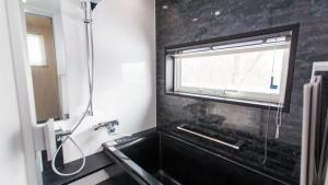 Ένα μπάνιο στο Shirokin Chalet walking distance to Rusutsu Resort +9 φωτογραφίες