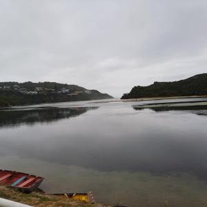 a view of a body of water with a beach at Ria's Rest Self Catering Flatlet in Sedgefield