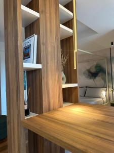 a room with wood paneling and a wall with shelves at Azuma Luxury Home in Bari +19 photos
