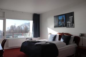 Postel nebo postele na pokoji v ubytování Milling Hotel Søpark + 37 fotografií