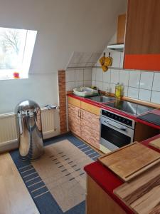 a kitchen with a sink and a stove at Ferienwohnung Bluhm Wahlstedt 
