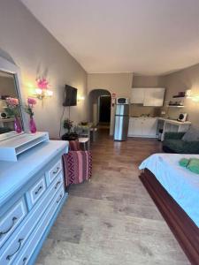 a large room with a kitchen and a bedroom at Studio near the beach in Albufeira