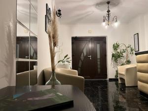 a living room with a table and chairs at Guesthouse Villa Stanger 2 in Lovran