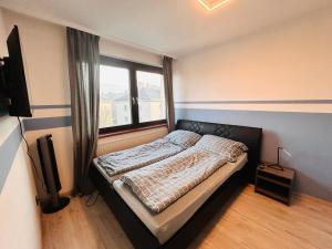 Un pat sau paturi într-o cameră la Apartment Wien - Near Schönbrunn Palace
