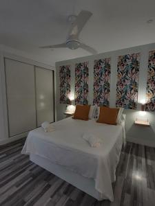 Ένα ή περισσότερα κρεβάτια σε δωμάτιο στο Triana