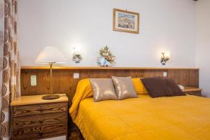 Säng eller sängar i ett rum på Hotel Tre Cime Terminillo