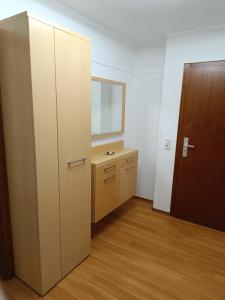 an empty room with a door and a sink at Ferienwohnung Schneider in Bad Wildungen