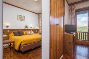 TV a/nebo společenská místnost v ubytování Hotel Tre Cime Terminillo + 6 fotografií