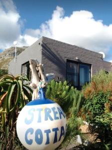 a sign that says fresh gotta in front of a house at Streams Cottage in Bettyʼs Bay