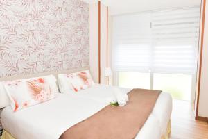 A bed or beds in a room at Hotel Ancora