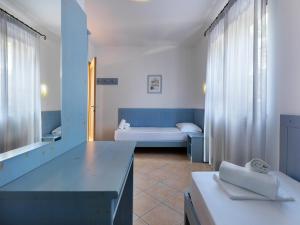 Postel nebo postele na pokoji v ubytování Residence Besass, GTSGroup