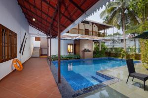an image of a swimming pool in a villa at The Isle By Area 707 in Alwaye