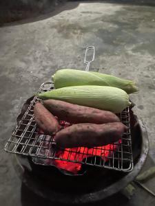 a bunch of vegetables sitting on a grill at The Garden Homestay Ninh Bình in Ninh Binh
