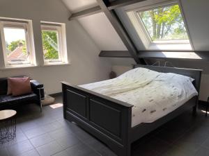 Säng eller sängar i ett rum på Vakantiehuis De Zeeuwse Schuur in de Zak van Zuid-Beveland