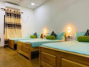Voodi või voodid majutusasutuse White Villa Hotel toas