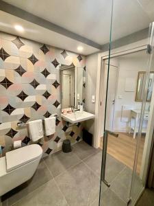 a bathroom with a toilet and a sink at Casa Rural Passivhaus Kostoenea in Hondarribia